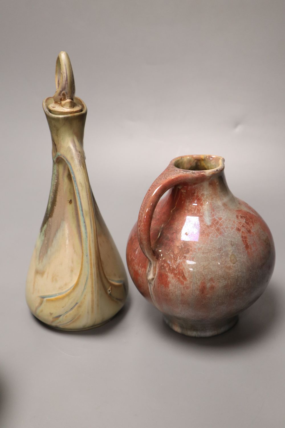 Three items of Art Pottery, including a stoneware ewer and stopper,